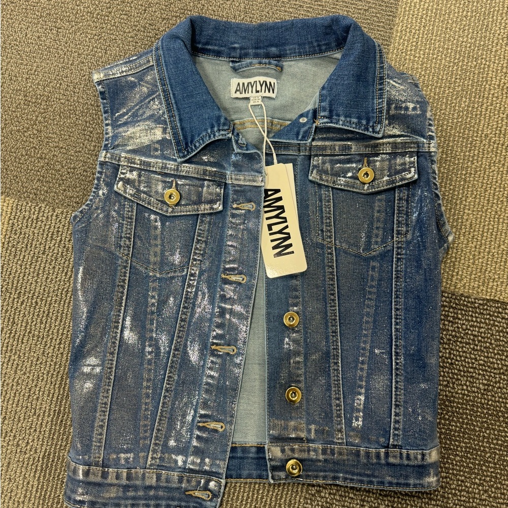 Amy Lynn denim vest with coated metallic finish.
